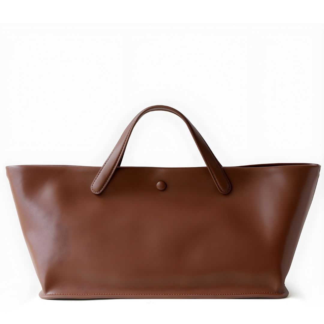 Brown leather tote bag on a white background