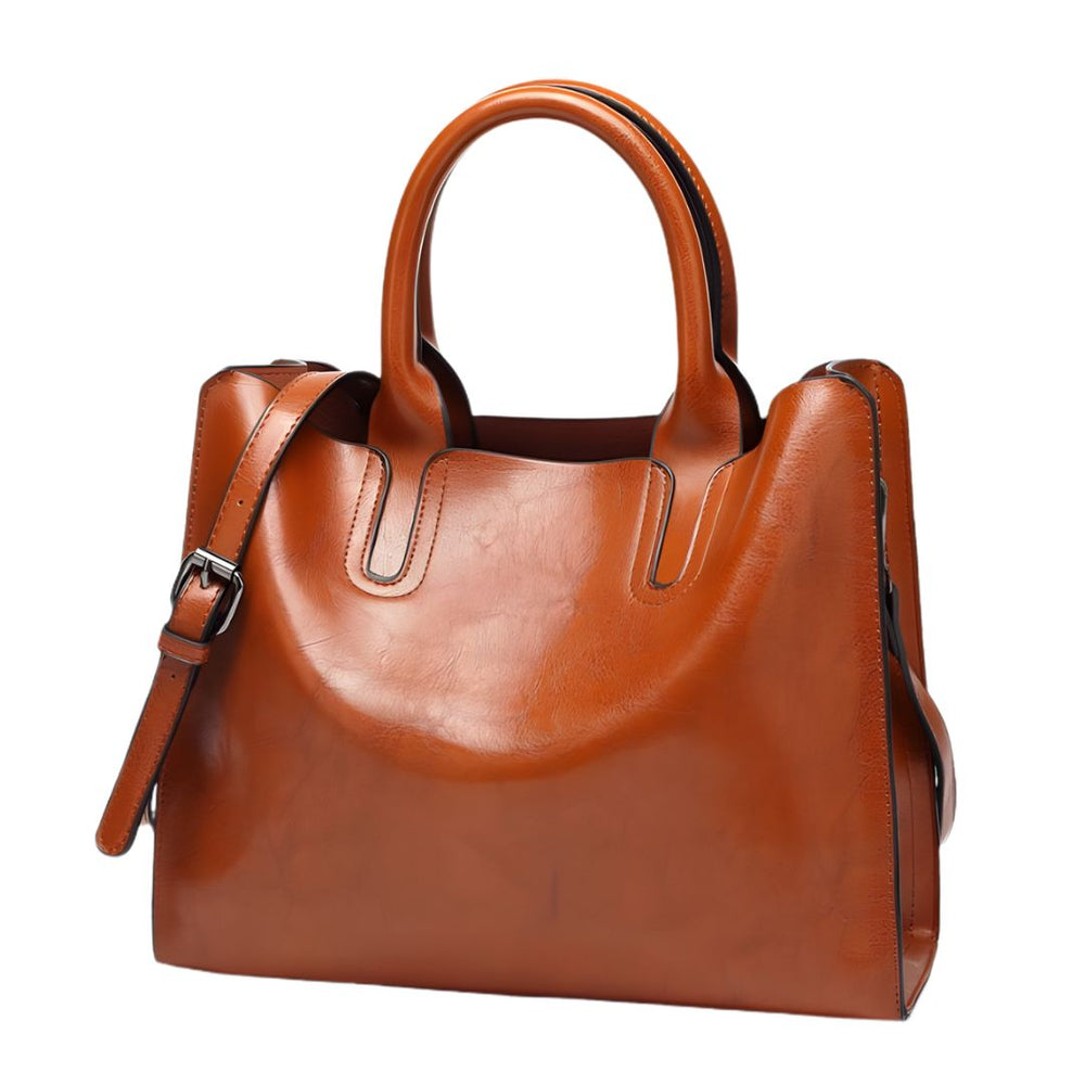 Brown leather handbag on a white background