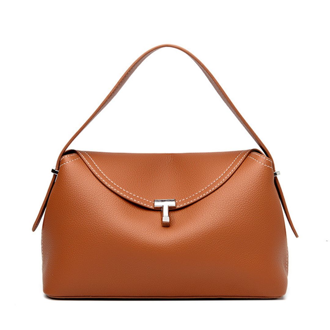 Brown handbag with a silver clasp on a white background