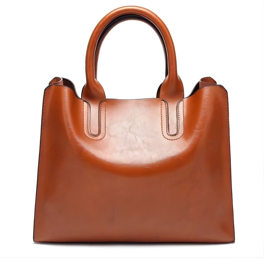 Brown leather handbag on a white background